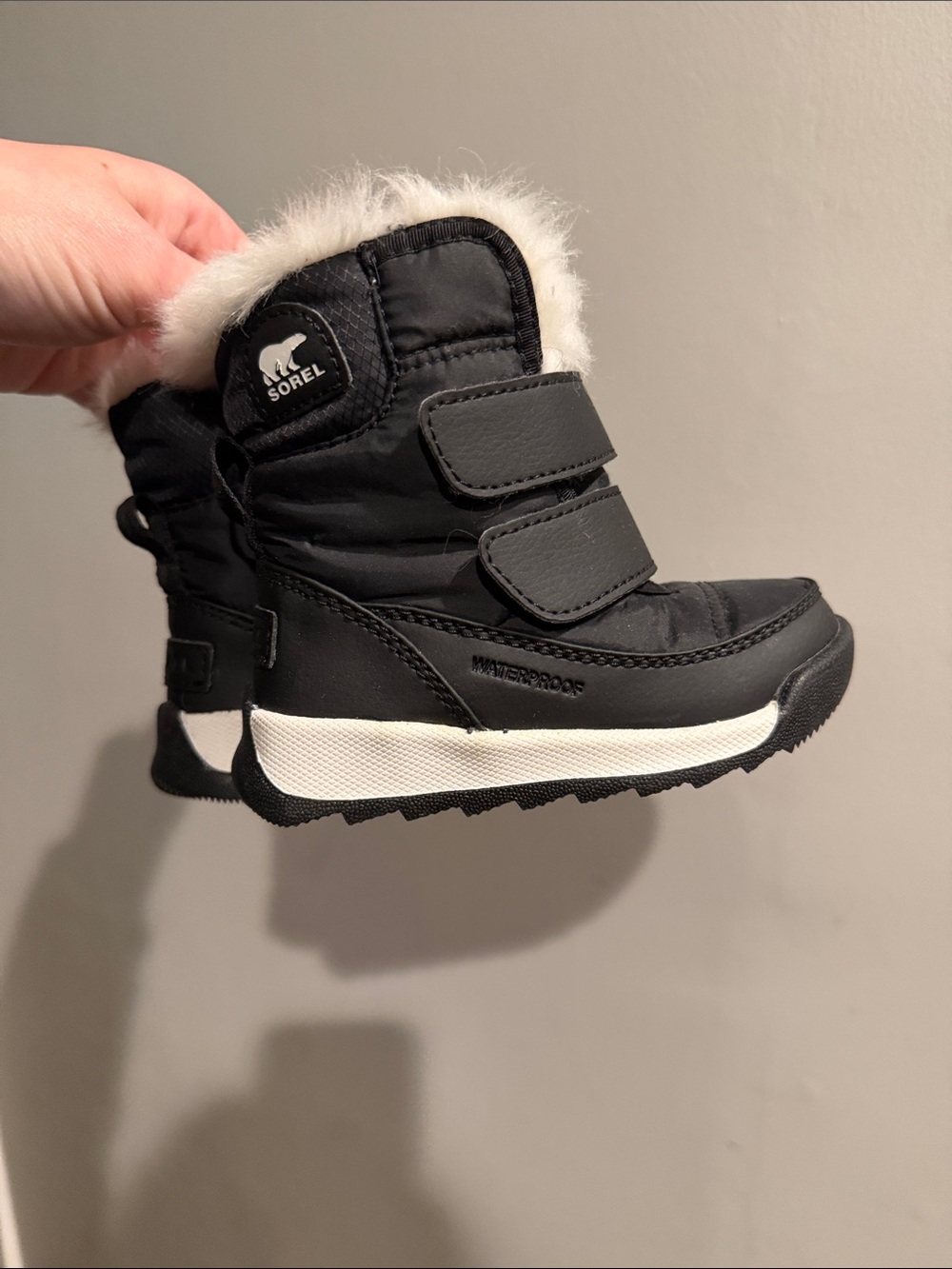 Sorel Black Winter Kids Boots with White Faux Fur Trim